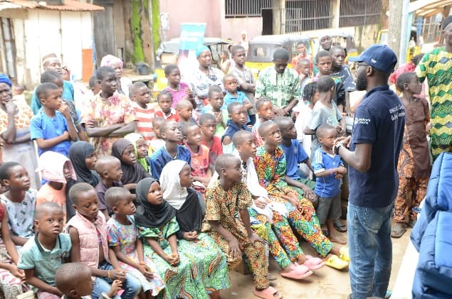 Children gathered at a TosaadecWorld Foundation community outreach